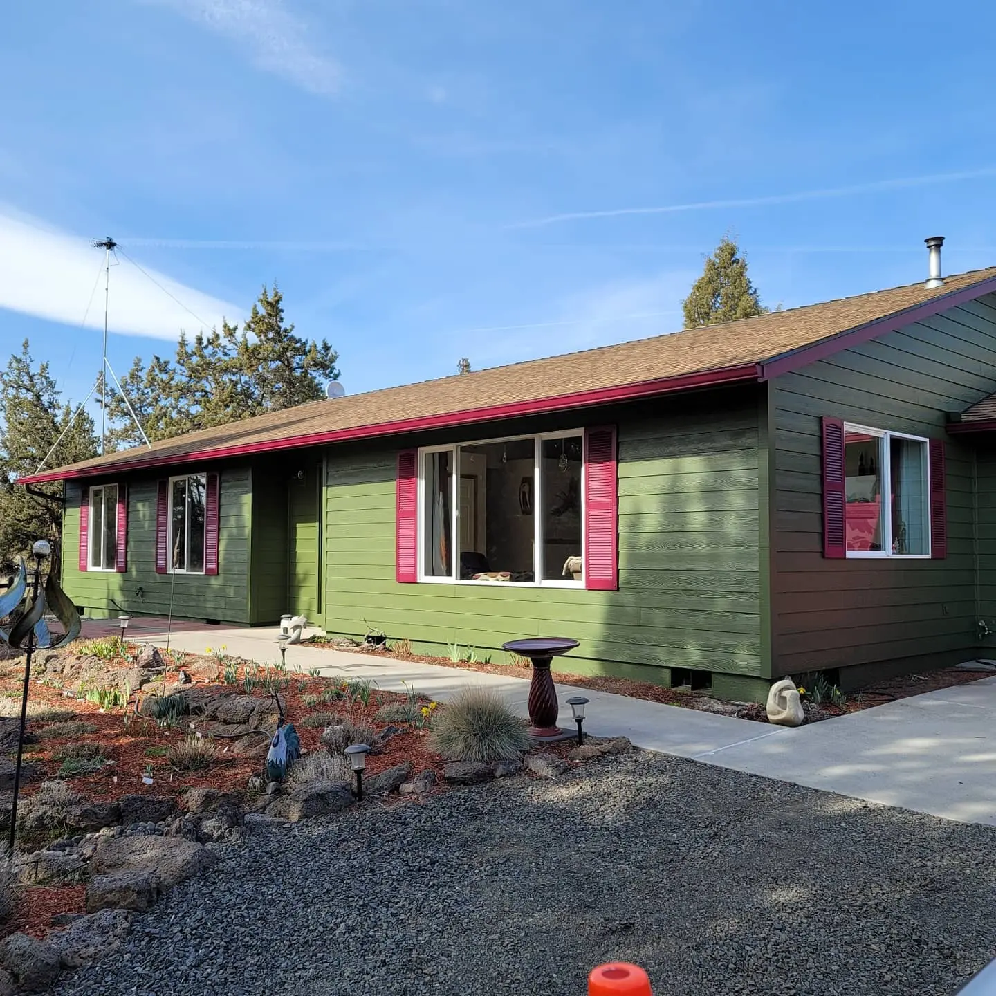 Completed exterior painting project in Redmond showing a modern olive and magenta color scheme.