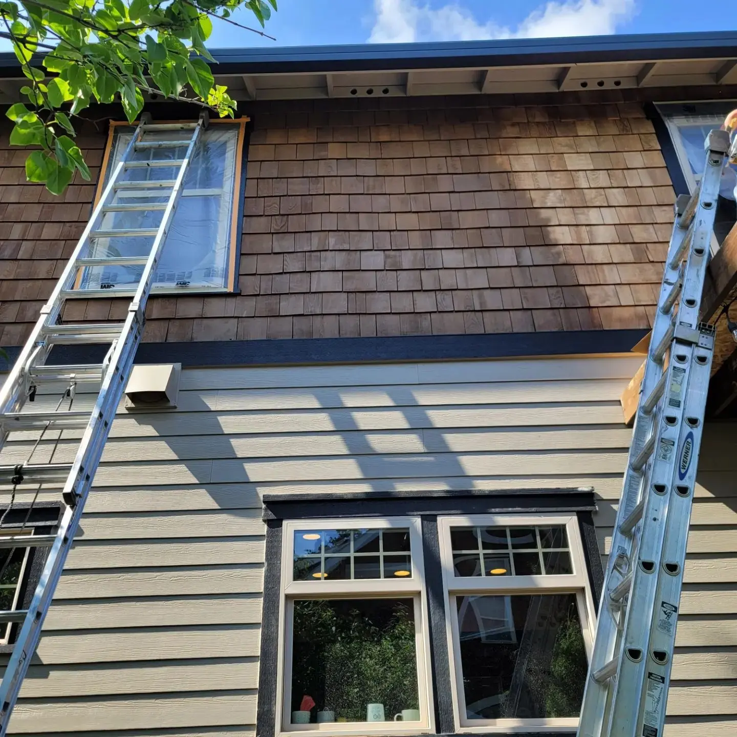 Close-up detail of the uniform stain application on cedar shingles for a home in Bend, Oregon.