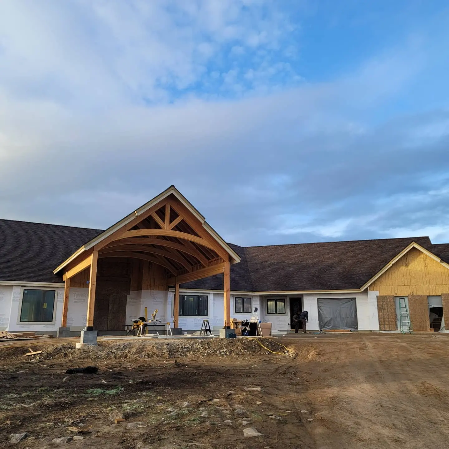 Exterior perspective of a large custom home project during the framing and wrapping phase in Eagle Crest.