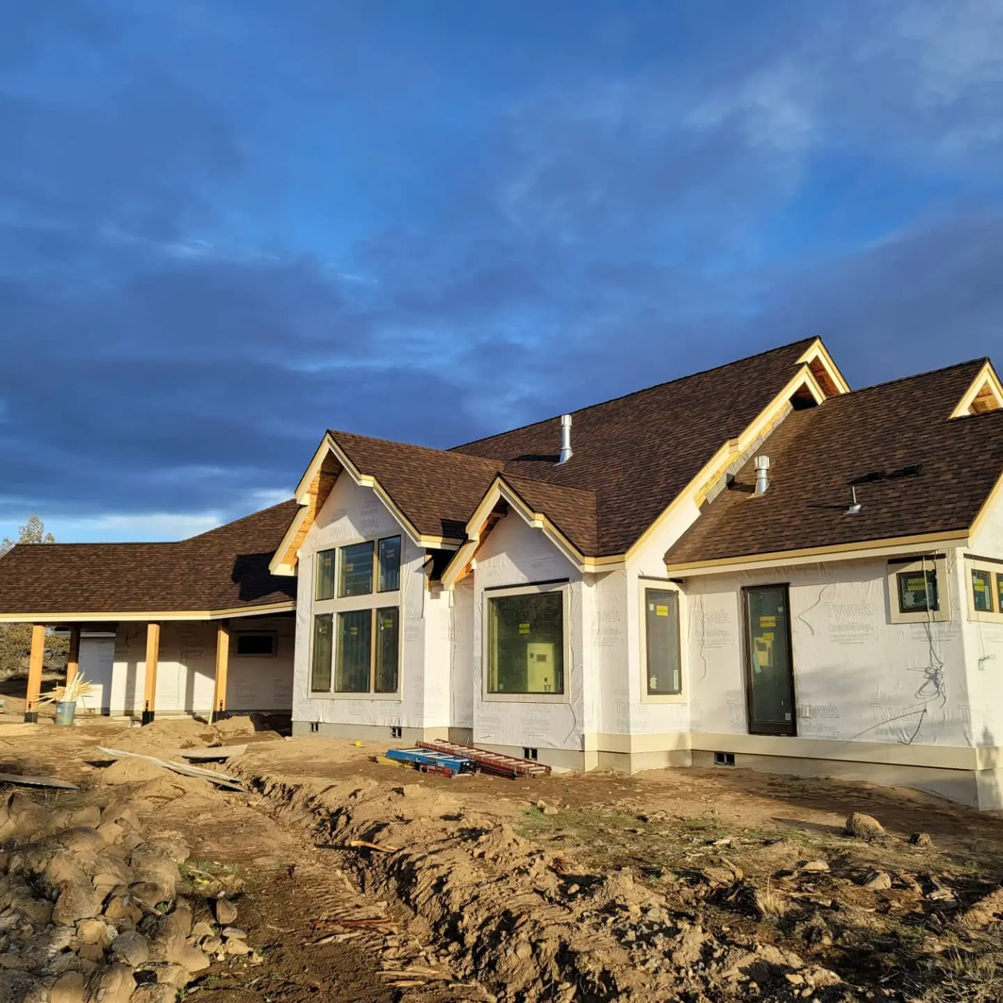 Complex roofline and exterior structure of a new luxury residence being built in Eagle Crest, Oregon.