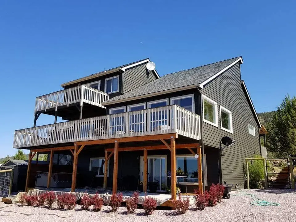 Corner perspective of the completed Powell Butte exterior renovation under a clear blue sky