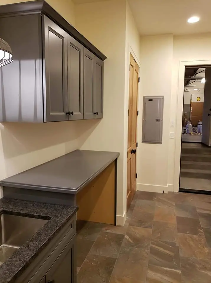 Custom grey painted cabinets and built-in desk area in a luxury Brasada Ranch home.