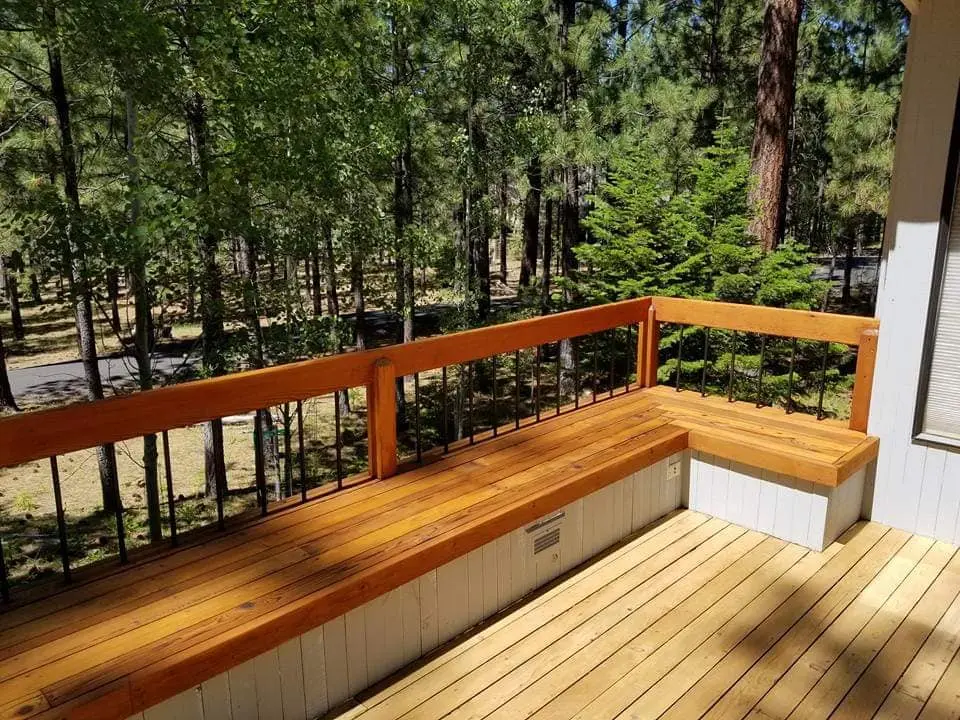 Corner view of a professionaly stained deck bench showing the smooth finish and natural wood grain